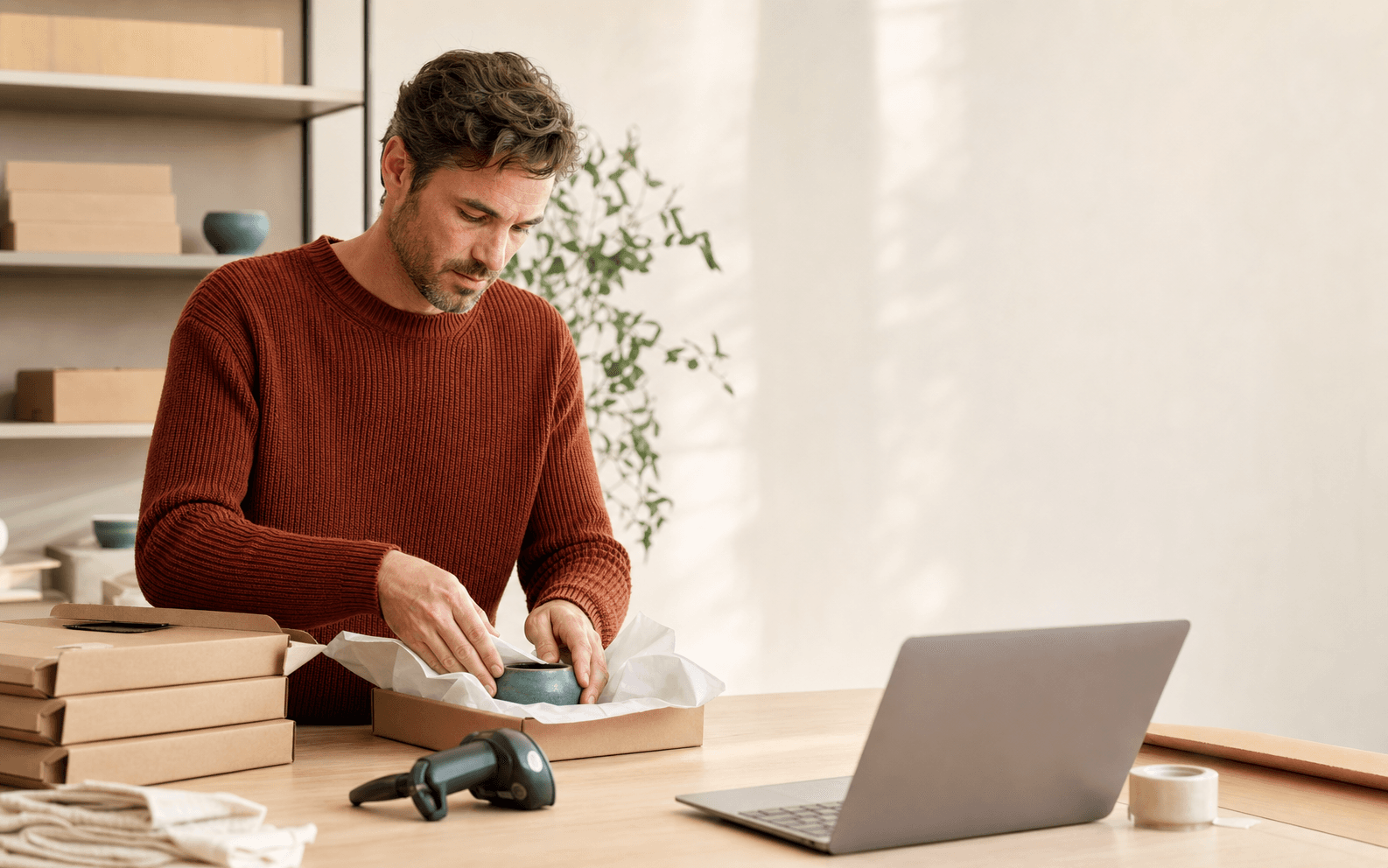 Operator preparing a premium customer order in a modern fulfilment studio